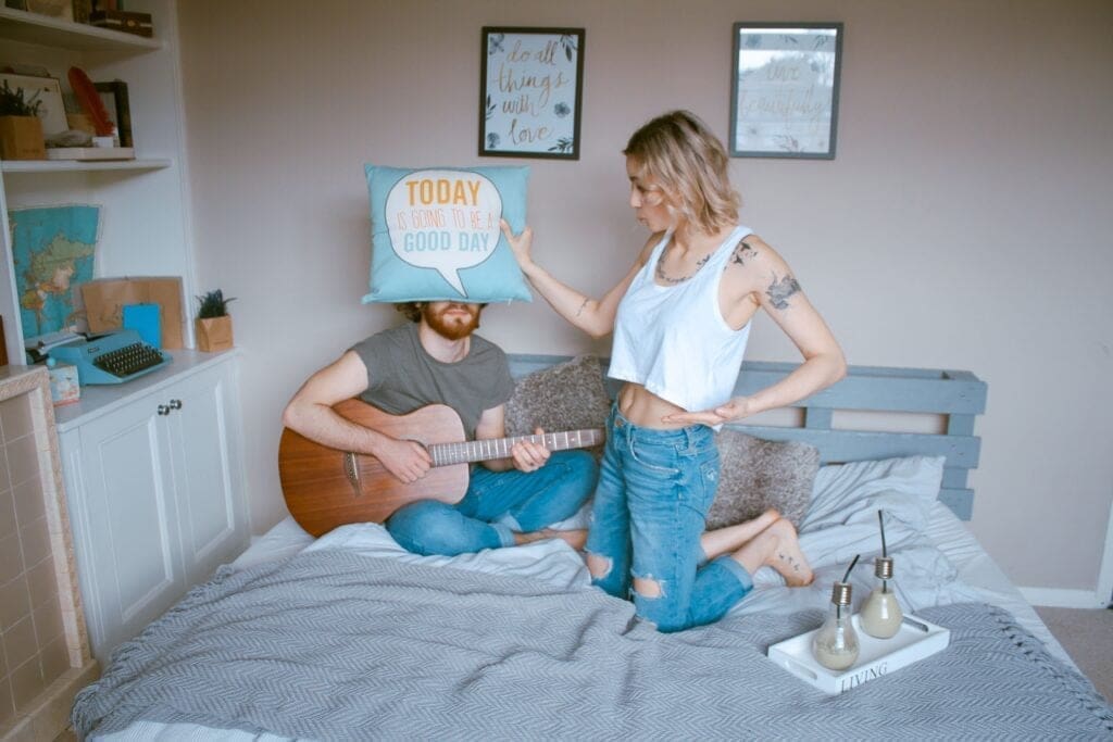 Young couple moved in together in shared bedroom 