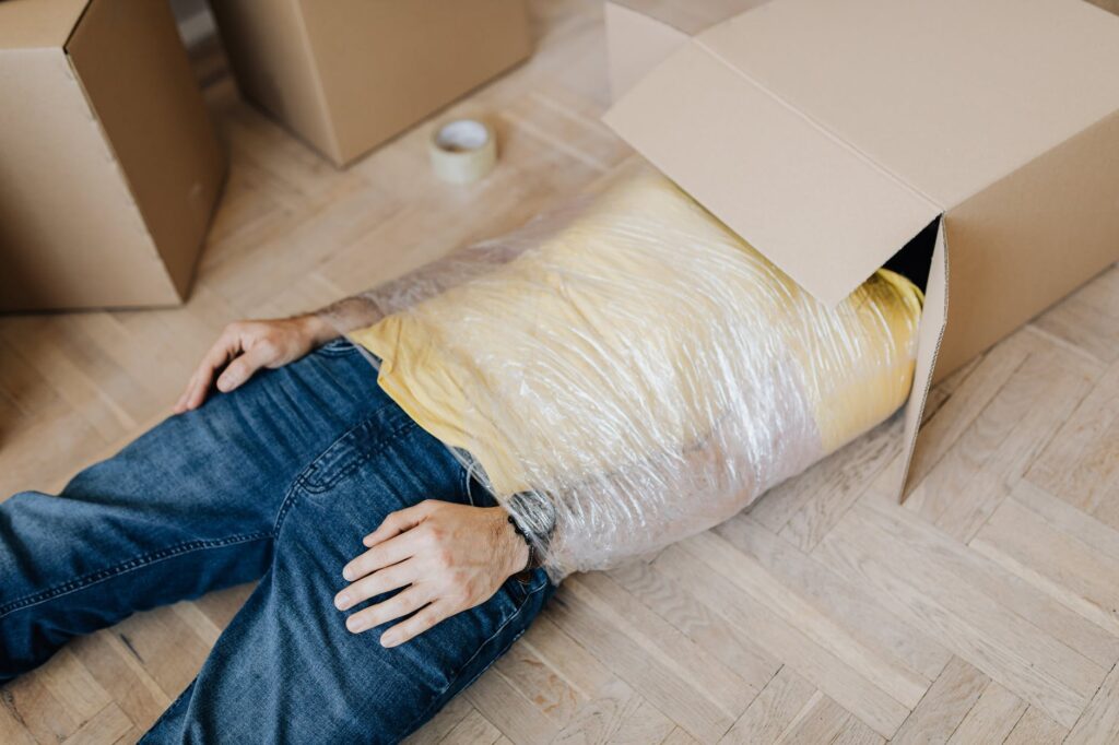 Moving locally during a pandemic, man sticks himself into a box